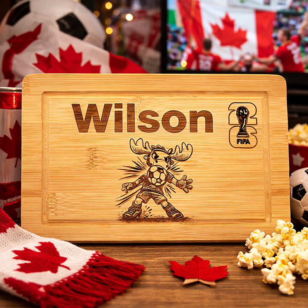 Wooden cutting board with engraved design and text, surrounded by sports-themed decor including a soccer ball and Canadian flag.
